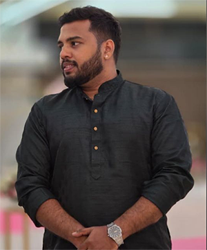 That's my picture wearing black glares sitting in a Garden.